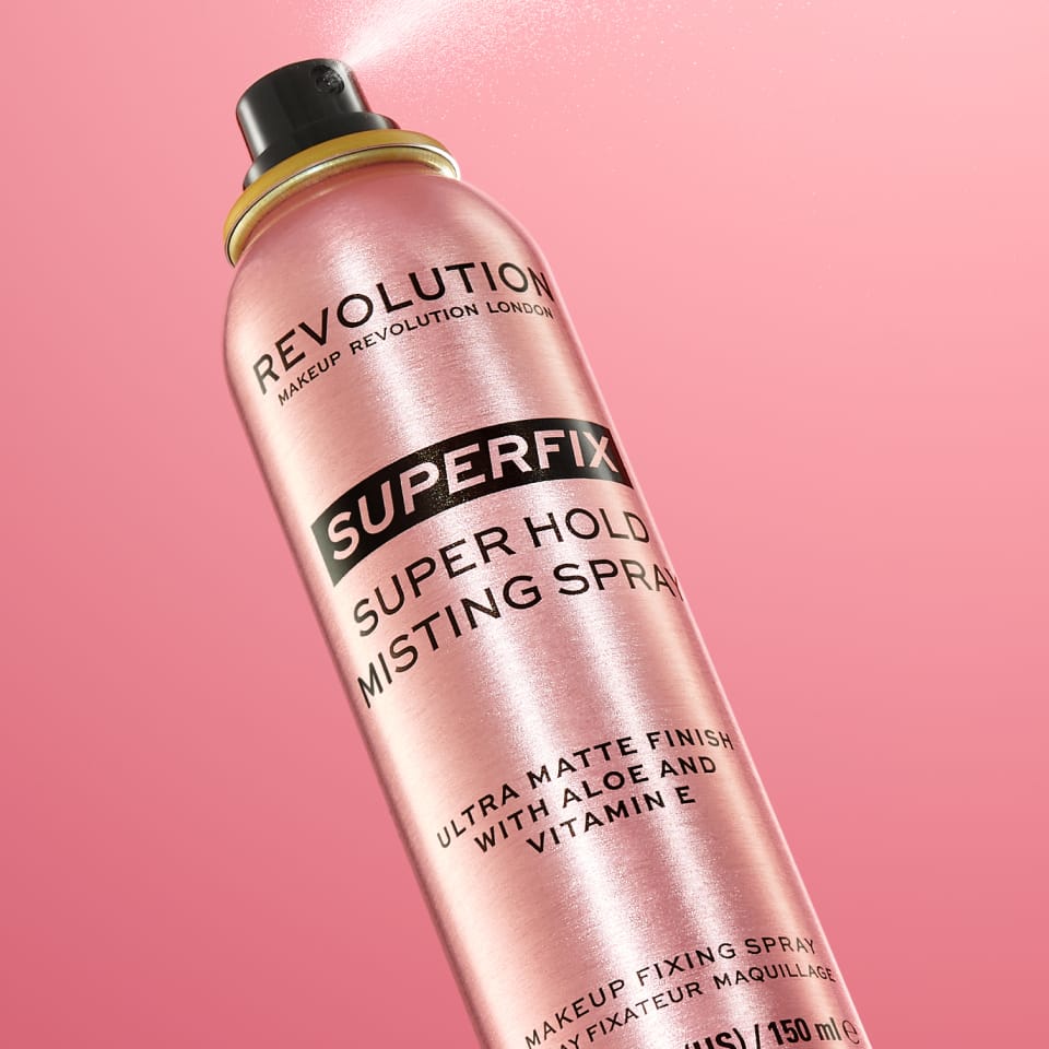 image of Revolution's Superfix Fixing Spray on a salmon-coloured background